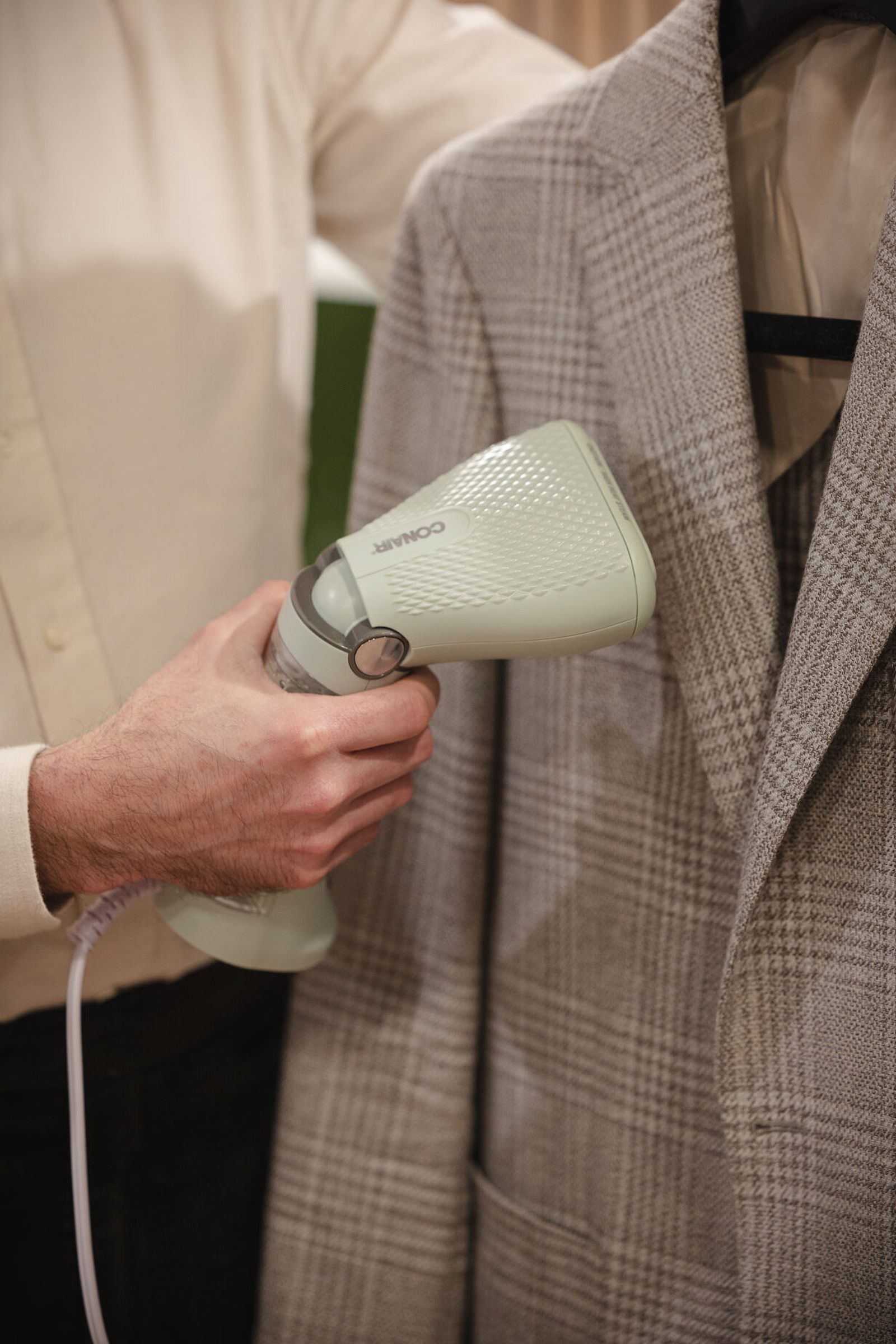 Conair Power Steam travel steamer in use