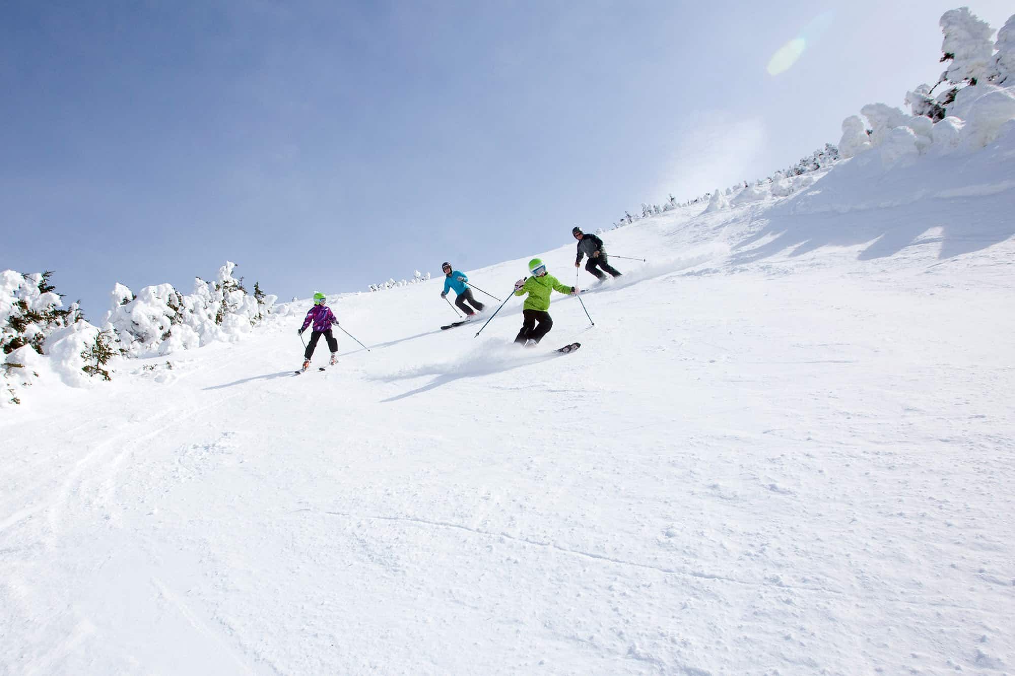 Four skiers on a mountain in Maine