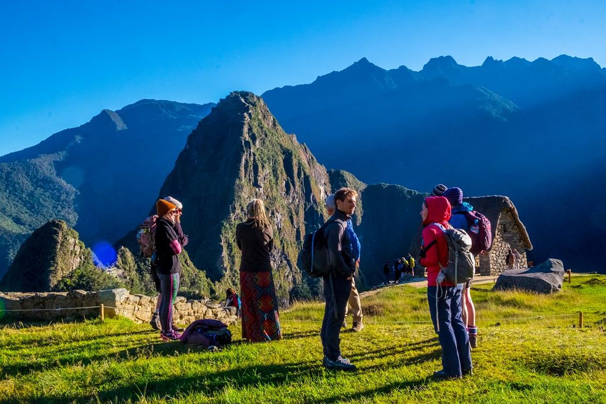 Group of tourists marveling at Machu Picchu